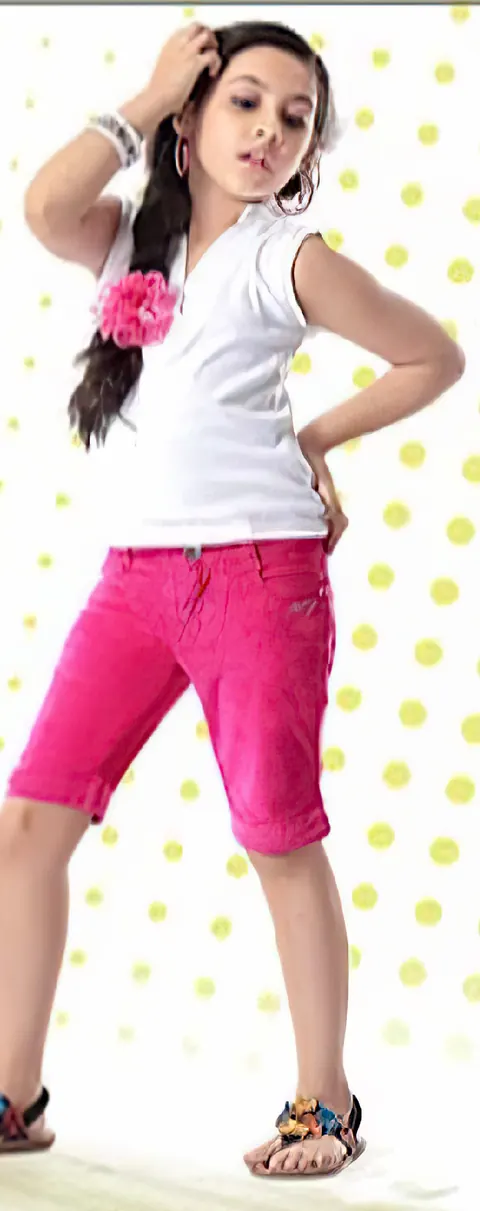 Girl in bright pink Miloni cord capris and a white top