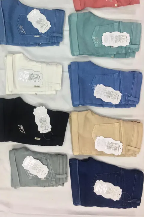 M 124 girls' shorts in a grid of colours from cherry to navy